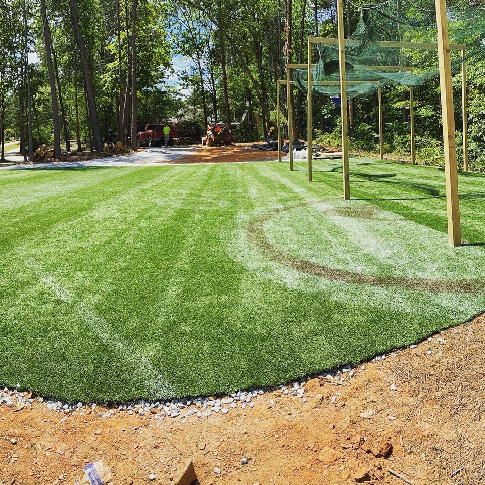 This is used artificial turf being utilized as a sportsfield in a backyard.