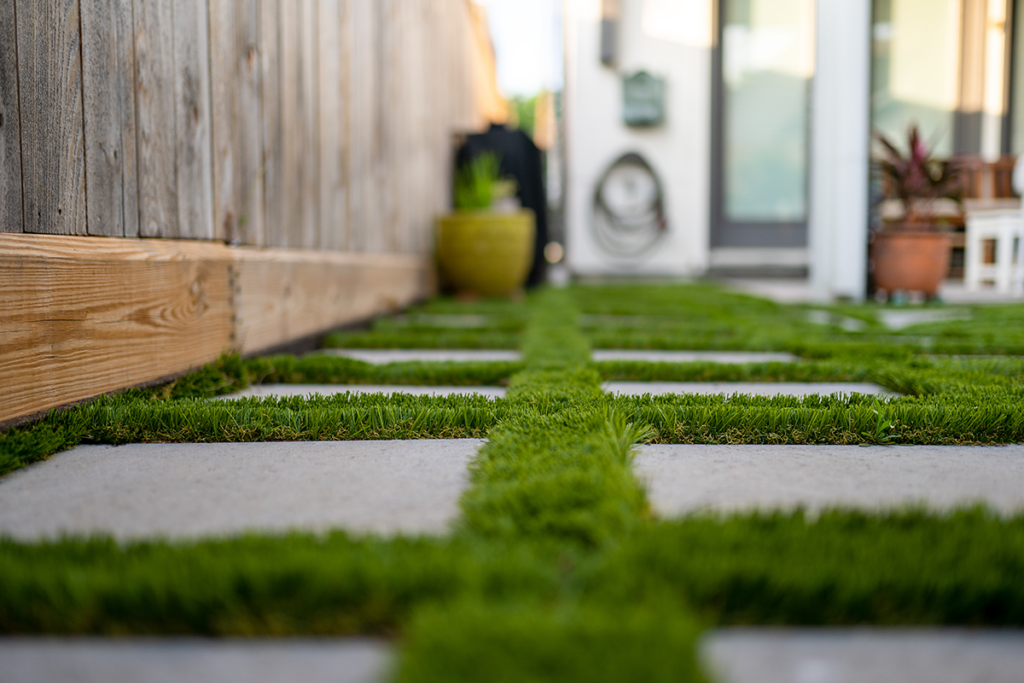 Artificial grass store between pavers