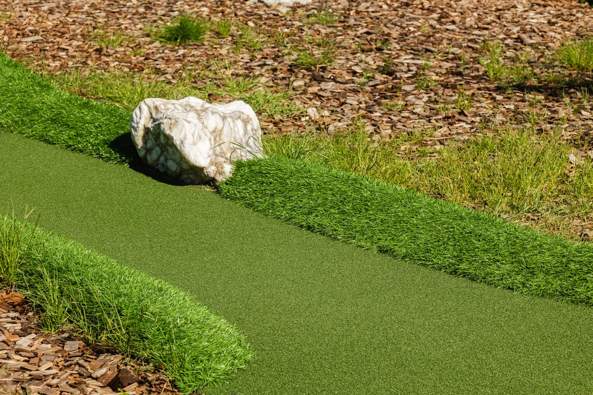 A picture of Can You Install Artificial Turf Next to Real Grass?